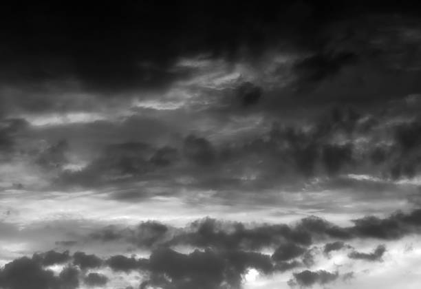 Dark storm sky with dramatic fluffy clouds. Cloudscape rainy season. Thunderstorm climate weather. Pollution smoke PM 2.5 Cabo dioxide concept. Scary Halloween.