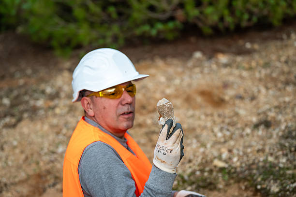 istock Geologist inspecting a mine,Explorers collect soil samples in search of minerals. 2249083470