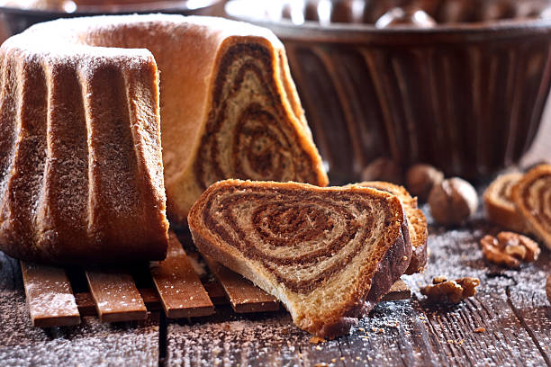 istock Potica - traditional Slovenian bread cake. Sweet bread roll stuffed with walnuts and sprinkle with sugar 2249083879