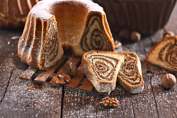 istock Potica - traditional Slovenian bread cake. Sweet bread roll stuffed with walnuts and sprinkle with sugar 2249083880