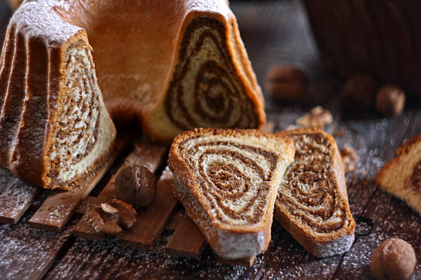 istock Potica - traditional Slovenian bread cake. Sweet bread roll stuffed with walnuts and sprinkle with sugar 2249083925