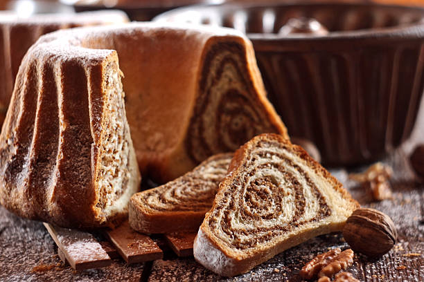 istock Potica - traditional Slovenian bread cake. Sweet bread roll stuffed with walnuts and sprinkle with sugar 2249083930