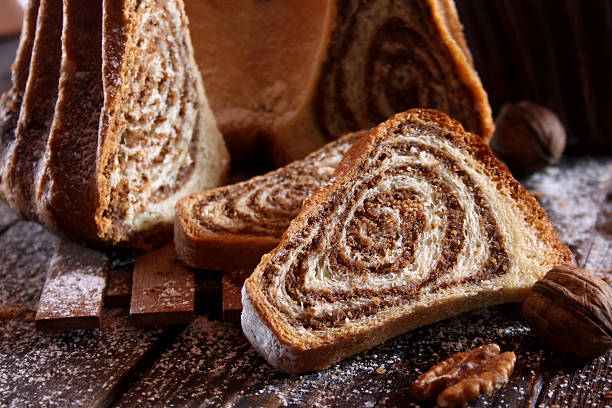 Potica - traditional Slovenian bread cake. Sweet bread roll stuffed with walnuts and sprinkle with sugar