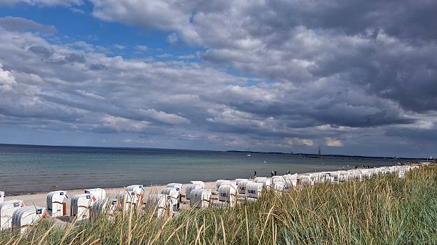 istock Baltic sea water waves sand sky clouds 2249085995