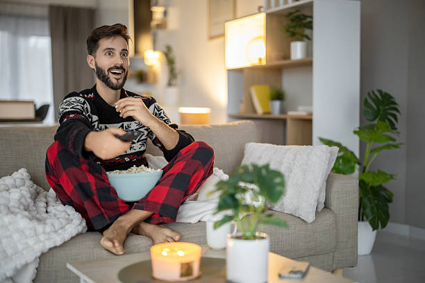istock Enjoying a cozy film night at home with popcorn and comfortable attire 2249086284
