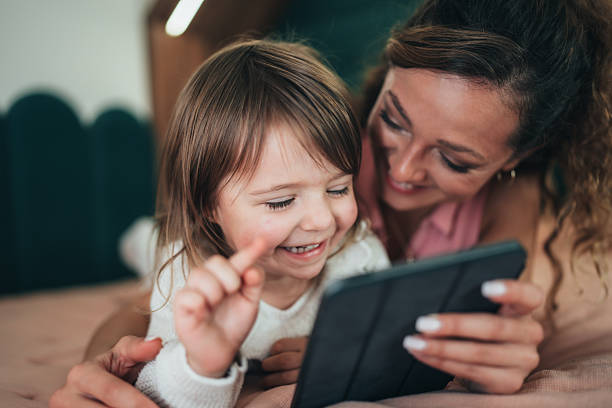 istock Mother and daughter sharing fun on a tablet 2249089153