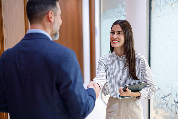 istock Business professionals shaking hands in office showing teamwork, success, and partnership agreement 2249089348