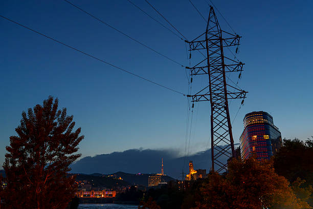 istock City skyline with power lines and modern tower at blue hour 2249089414