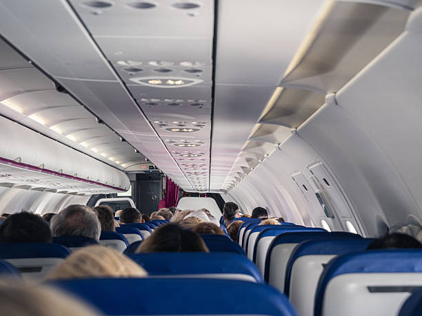 istock Passengers seated inside commercial airplane cabin 2249089785