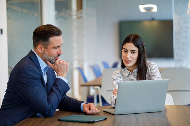 istock Two business professionals reviewing data on a laptop, discussing corporate strategy and ideas in a collaborative workplace 2249090690