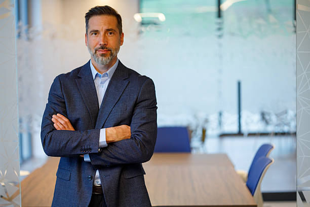 istock Business executive standing in modern office, confident and authoritative portrait conveying leadership, strategy and professional success 2249092474