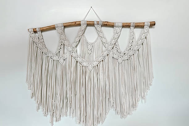 Elegant macrame wall hanging made from natural fibers in a modern home setting