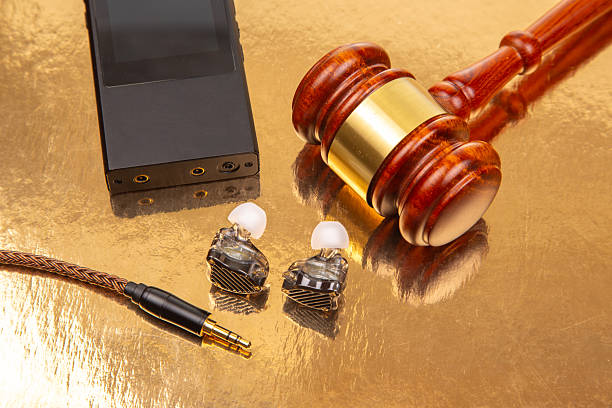 istock High-quality audio equipment and a gavel on a reflective surface in a legal setting 2249097399