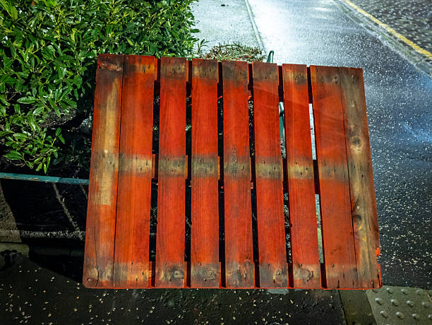 close-up of colorful wood reusable pallets. business, industry, and economy texture banner abstract background. logistics, supply and demand or global trade design element