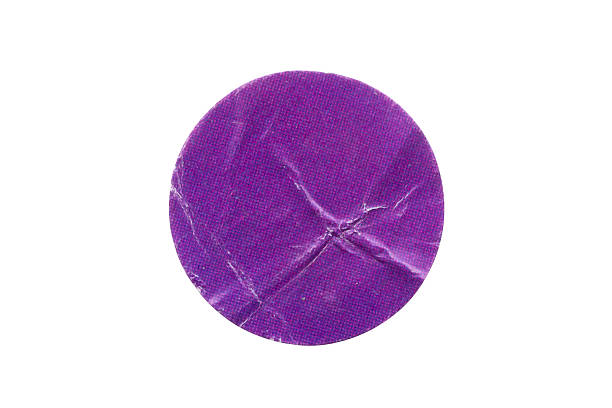 istock Blank purple round adhesive paper sticker label isolated on white background 2249099221