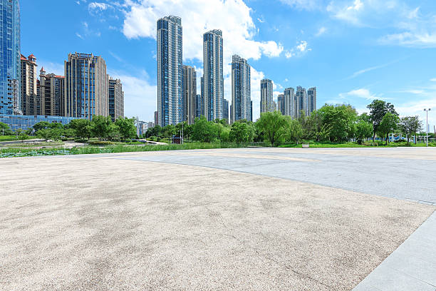 istock Empty square floor with modern urban skyline and sunny blue sky background 2249103355