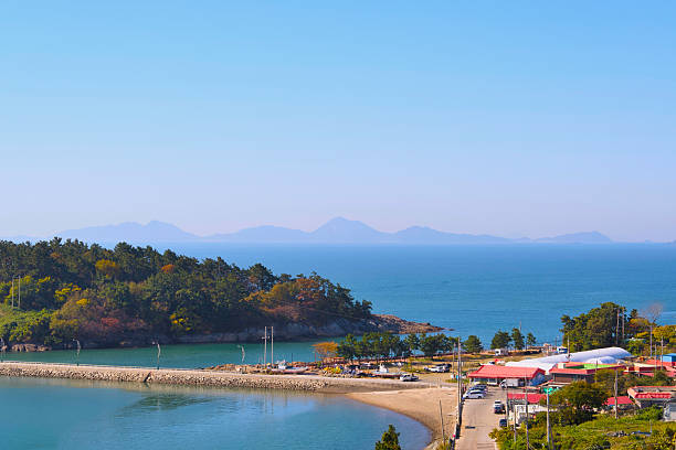 istock A village with a distant view of the island and a path right next to it 2249104439