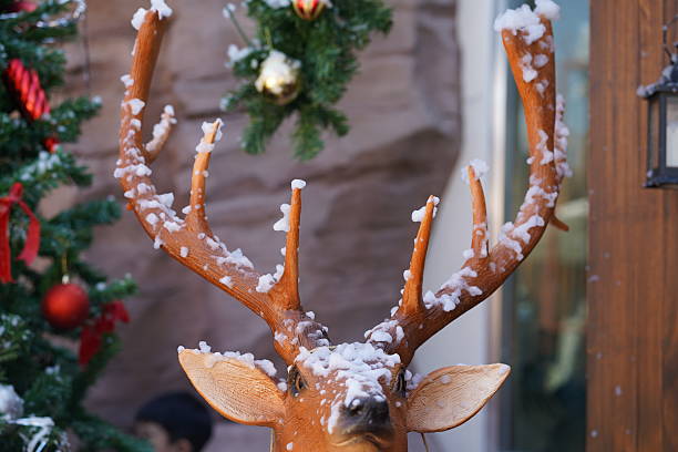 Reindeer with a red nose, a minimalist Christmas composition in a traditional red-green color palette