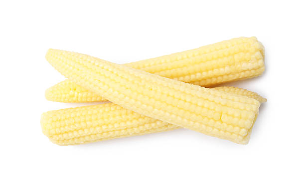 istock Tasty fresh baby corns isolated on white, top view 2249111254