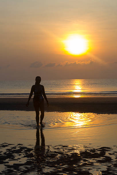 istock Sunrise and silhouette traveler 2249111482