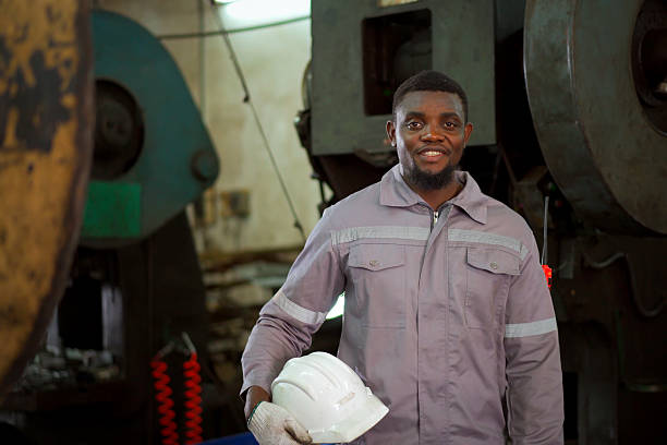 istock African American engineer smiling confidently in industrial factory. 2249117372