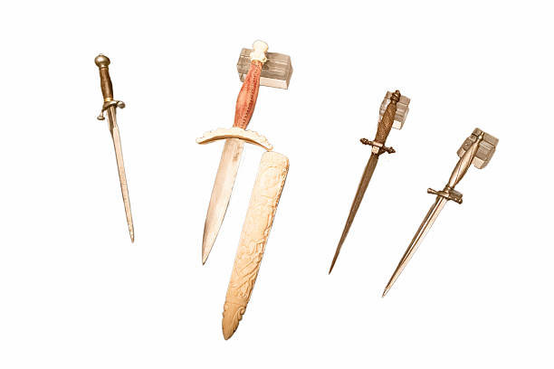 istock Collection of decorative swords displayed on a white background showcasing unique designs and craftsmanship details 2249119838