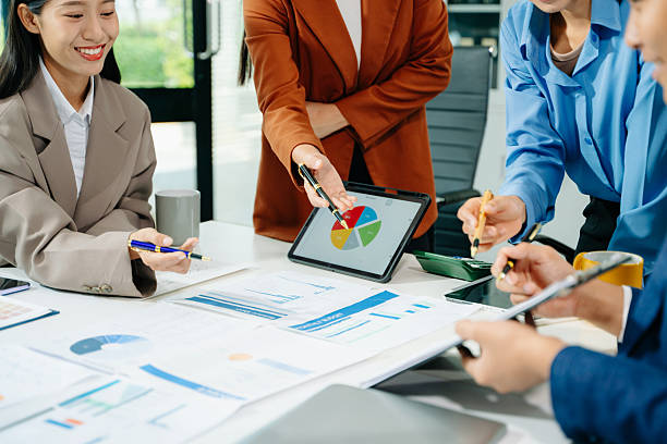 istock Team work process. Photo young business crew working with new startup project. Project managers meeting 2249124115