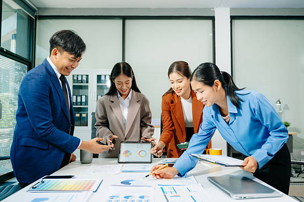 istock Professional teamwork as business colleagues engage in strategy, planning, and discussion, showcasing growth 2249124117