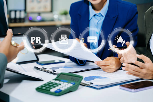 istock PR, Public relations concept. hands using laptop and tablet with public relations icon for communication advertising marketing strategy. with Ads and sales 2249124168