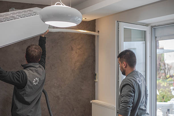 istock Installing an air conditioner, two young craftsmen 2249124221