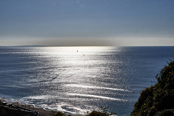 istock Scenic view of ocean with sunlight reflection 2249125611