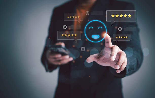 istock Businessman giving five star rating with happy face icon on virtual screen, representing excellent customer service, user experience, satisfaction, and online review concept. 2249128208