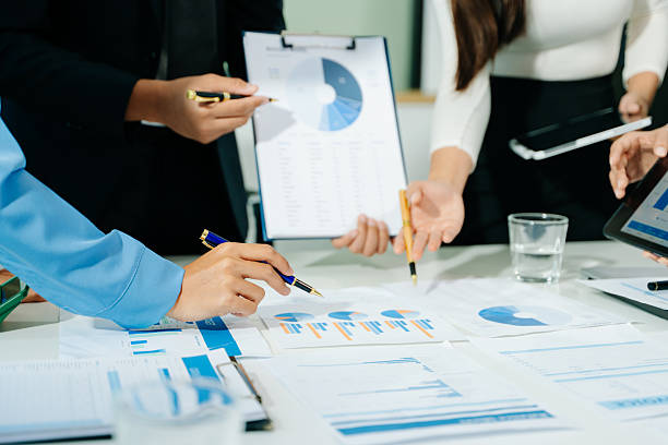 istock Businessman and team analyzing financial statement Finance task. with smart phone and laptop and  tablet. 2249128914