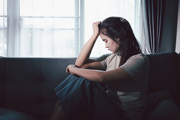 istock Sorrowful woman sat alone, overwhelmed by emotion, her sad and unhappy expression revealing deep despair, stress and distress left feeling depressed. sorrowful sad, despair alone, depressed stress 2249129311