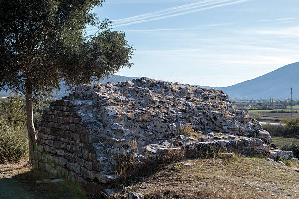This stock photo features the excavated architectural fragments and stone artifacts from the ancient Temple of Zeus in Euromos, displayed in the open-air museum area in Milas, Muğla. These pieces—column drums, capitals, friezes, and carved stone blocks—were uncovered during ongoing archaeological excavations at the Euromos site. Each artifact reflects the craftsmanship of the Hellenistic and Roman periods, offering insight into the temple’s original scale and architectural sophistication. The open-air arrangement allows visitors to observe the details of the ancient stones up close while appreciating the historical significance of one of Caria’s most important archaeological sites.