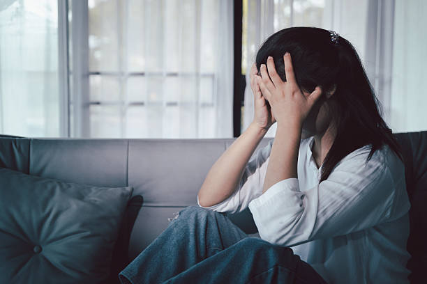 istock Sorrowful woman sat alone, overwhelmed by emotion, her sad and unhappy expression revealing deep despair, stress and distress left feeling depressed. sorrowful sad, despair alone, depressed stress 2249130523