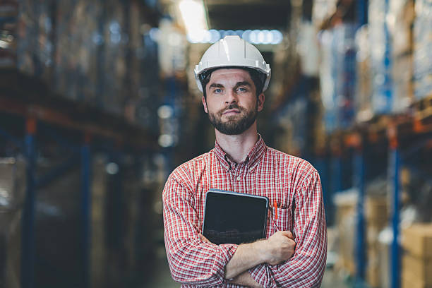 istock Warehouse worker working in warehouse storage. Foreman or worker work at factory site check up products in site. Inventory worker working in  factory Storehouse 2249130886