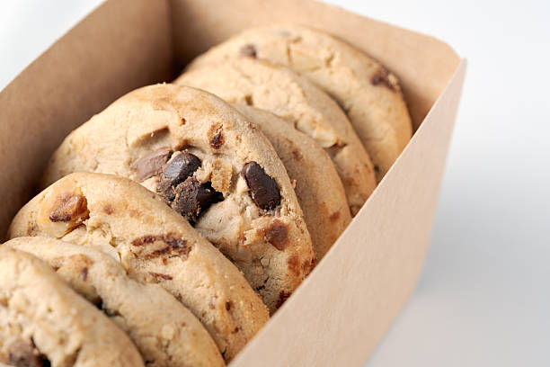 Baked chocolate chip cookies in a tin box at confectioner's