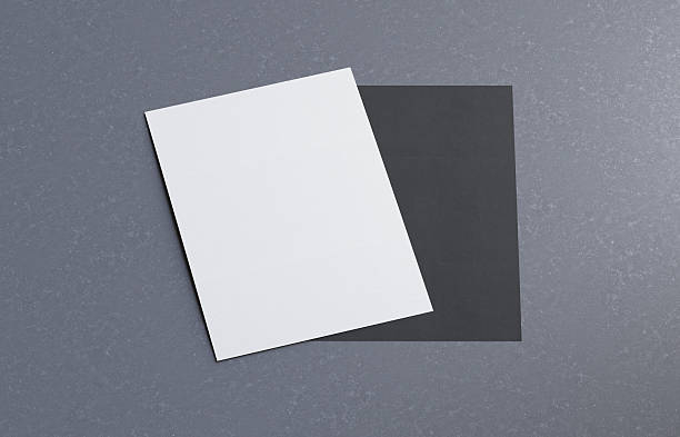istock Empty white vertical rectangle poster mockup on gaystone desk 2249131566