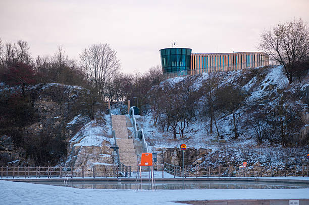 istock Snowy Outdoor Pool with Modern Hilltop Building 2249134419