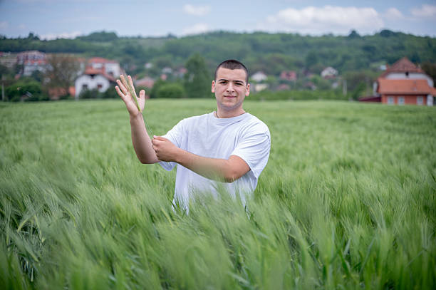 istock Young man in a field of cereals. 2249134600
