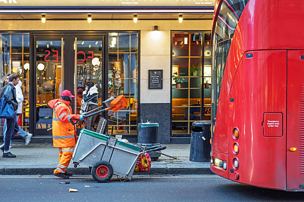 Man hand throwing paper into trash bin