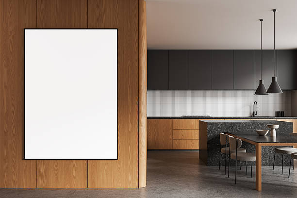 istock Modern kitchen interior with blank white poster on wooden wall partition near dining area for design mockup template presentation display concept. 3D Rendering 2249144581