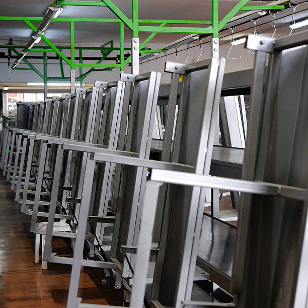 Metal panels hanging on a Conveyor line in a Production unit.