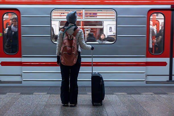 istock Woman With Suitcase Waiting For The Metro 2249145315