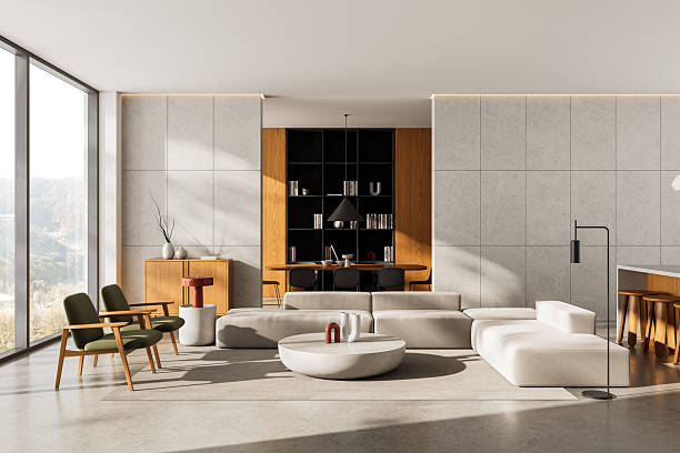 istock Modern interior living room with minimalist design and natural lighting, featuring cozy furniture and clean architecture in warm neutral tones. 3D Rendering 2249145613