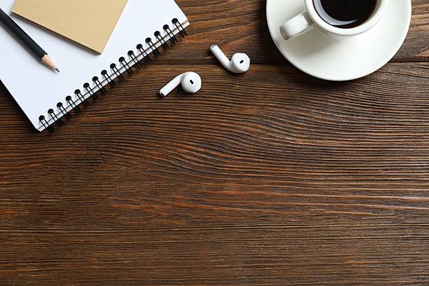 istock Office table with notebook, stationery and cup of coffee, top view 2249146806