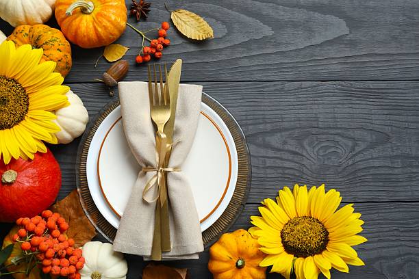 istock Rustic holiday table setup. Top view with plates, cutlery and autumn decorations. Empty space for your text 2249147666