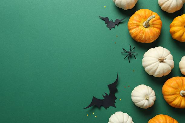 istock Halloween festive background design featuring orange pumpkin, black bats and spiders. Happy Halloween holiday concept 2249148897