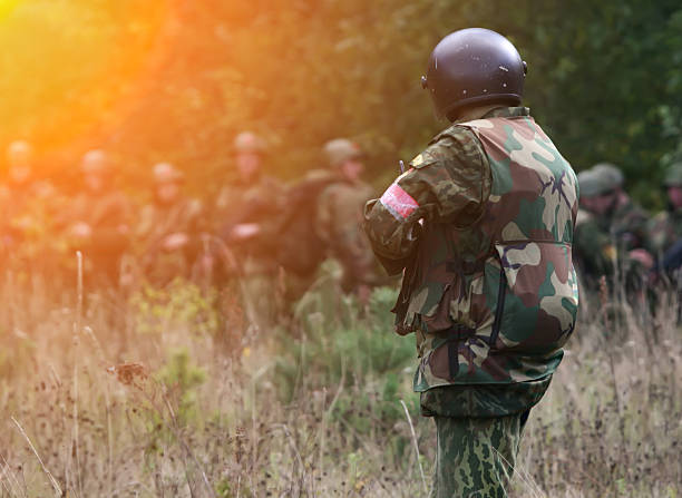 istock Soldiers training in a forest area during daylight activities focused on teamwork and tactical skills 2249150167